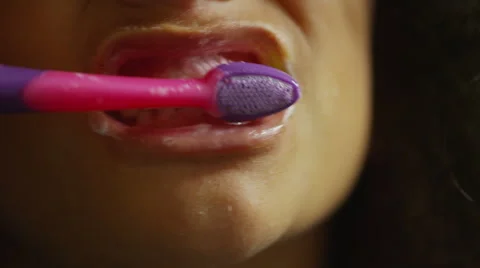 Child brushing their front teeth in slow motion Stock Footage 50582617