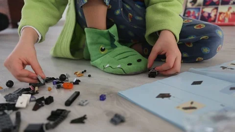 Child Building a New Interlocking Plastic Bricks Toy Stock Footage 123494407