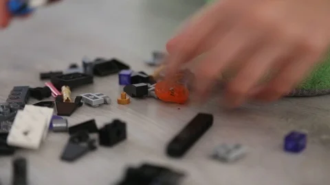 Child Building a New Interlocking Plastic Bricks Toy Stock Footage 123494519