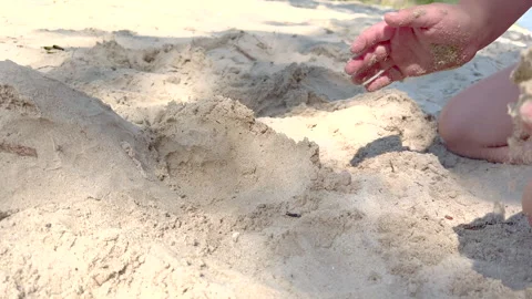 Child building sandcastle on beach Stock Footage 303519528