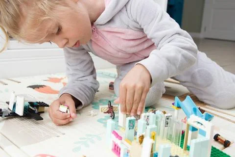 Child builds with constructor bricks, plays with toys Stock-Fotos