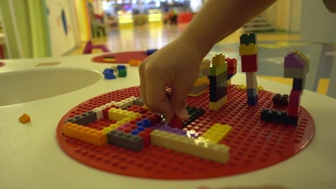 Child built a construction site with colourful interlocking brick Stock Footage 92217088