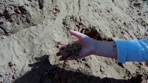 The child is busy in the sandbox Stock Footage 78050009