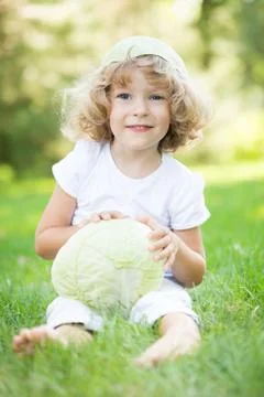 Child with cabbage Stock Photos