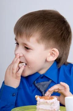 Child with cake Stock Photos