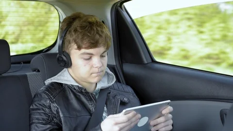 Child in car with tablet Stock Footage 106434215