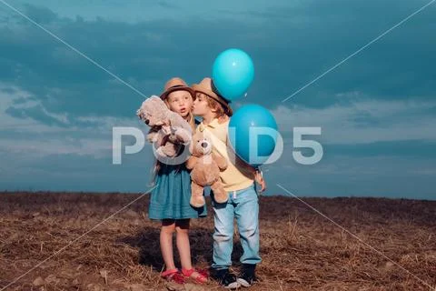 Child care. Beautiful little couple - boy and girl embracing. Childcare Stock Photos