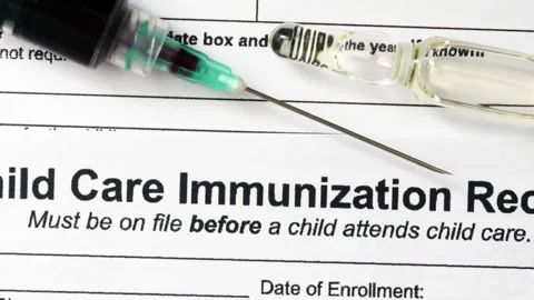 Child care immunization record document Vídeo Stock 344476565