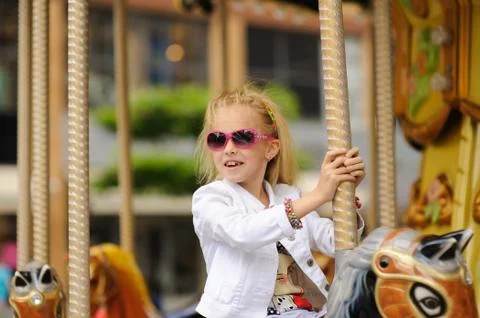 Child On Carousel Foto stock