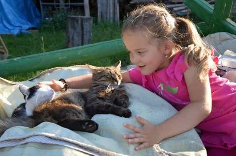 Child with cat Stock Photos