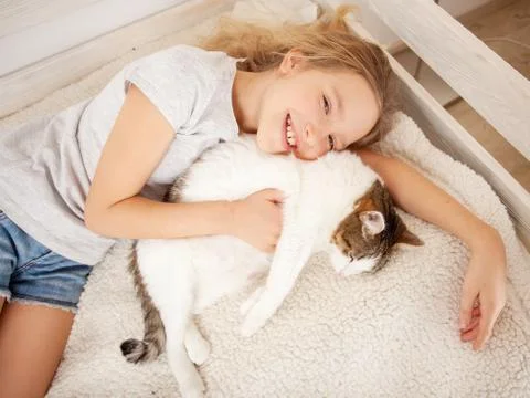 Child with cat Stock Photos