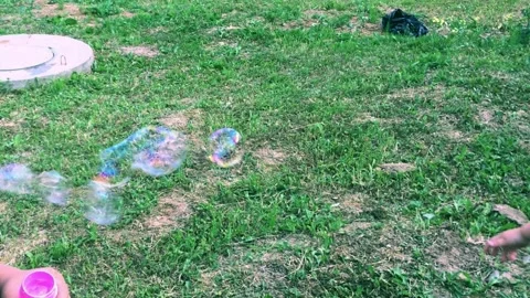 A child catches soap bubbles Stock Footage 201688078