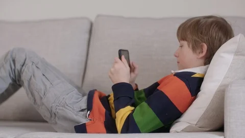 Child on cell phone Video stock 127050865