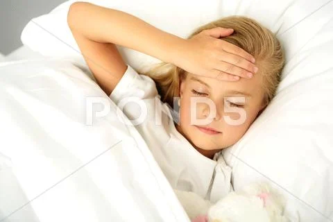 Child checking her head Stock Photos