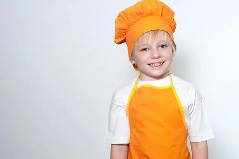 Child as a chef cook 库存照片