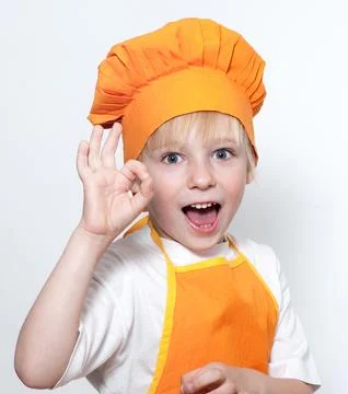 Child as a chef cook 库存照片