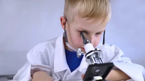 Child chemist. Teacher shows a visual experiment. A science mentor teaches an ex Stock Footage 267007859
