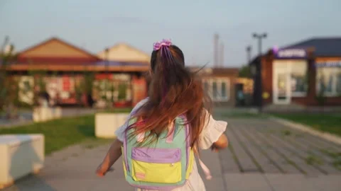 Child with children backpack runs school city park. children education. child Video stock 246958447