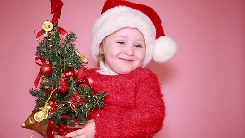 Child with a Christmas tree Stock Footage 139619739