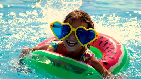 A child in a circle swims in the pool. Selective focus. Stock Footage 165219485