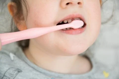 Child cleaning the teeth. Stock Photos