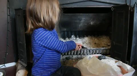 Child Cleans out fireplace Stock Footage 12288549
