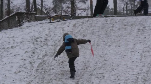 Child is Climbing up the Hill Slides Mom Pointing to the Way Kids Riding on a Stock Footage 59132140