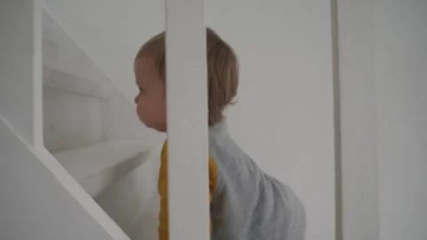 Child Climbing Up the Stairs Stock Footage 300800125