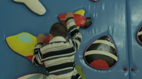 Child climbing on a wall Stock Footage 33352929