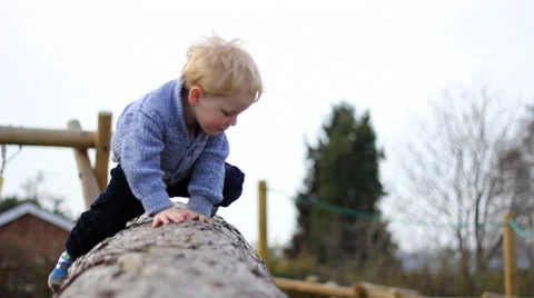 Child climbs on log Stock Footage 46724023