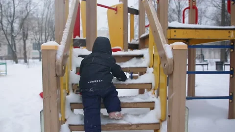 A child climbs the stairs Stock Footage 166364696