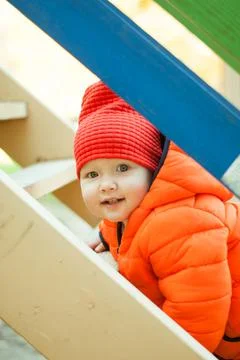 The child climbs the steps on the playground Stock Photos
