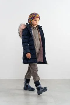 Child in clothes in studio 写真素材