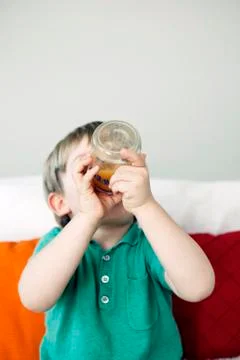 Child with cold drink Stock Photos