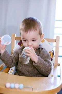 Child with cold drink Stock Photos