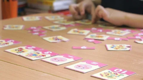 Child collecting a pattern using puzzles. Close-up Video stock 70970207