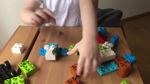 A child collects a car from a blocks constructor video Video stock 228652714