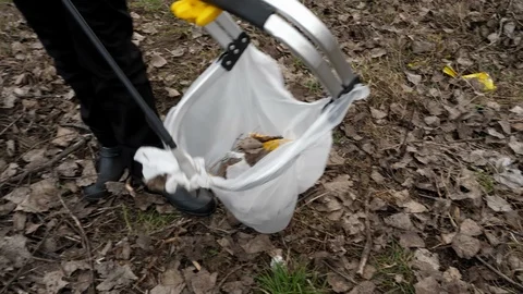 A child collects garbage a large plon, a basket of feet a sign of infection Stock Footage 124301543