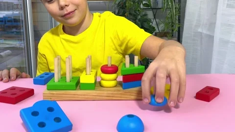 The child collects a sorter. Stock Footage 255772630