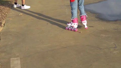 Child on Colorful Roller Skates Stock Footage 283209863