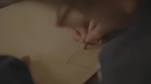 A child coloring with crayons on paper Stock Footage 103822913