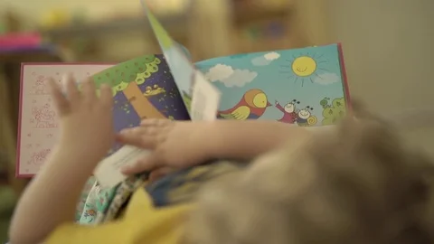 Child with colour book Stock Footage 75930482
