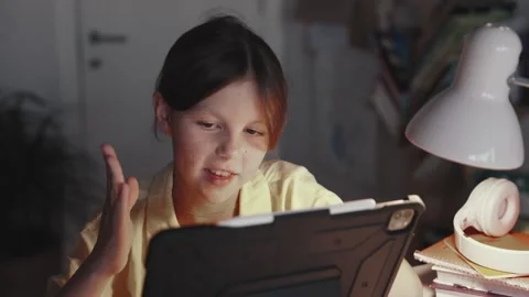Child Communicates with Teacher Online. Distant School Learning Concept. Stock Footage 255374123