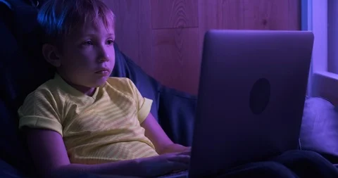 Child with computer at home, 8 years.  Boy typing text message on keyboard. L Stock Footage 118520918
