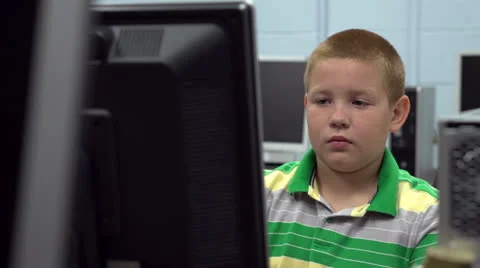 Child in computer lab at school Stock Footage 26584189