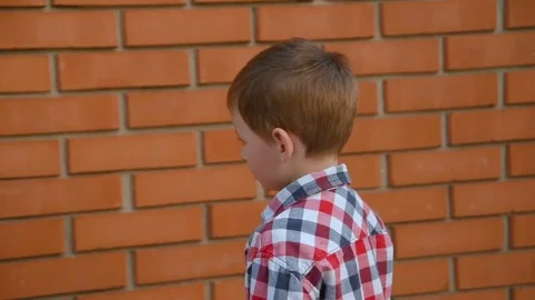 A child in a construction helmet Stock Footage 79605656