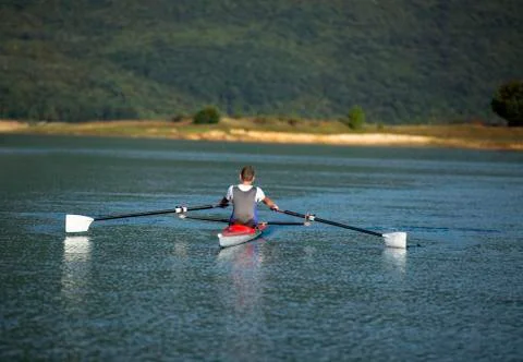 Child in the course of rowing on single Stock Photos