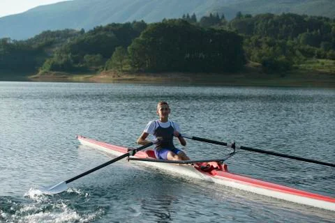 Child in the course of rowing on single 写真素材
