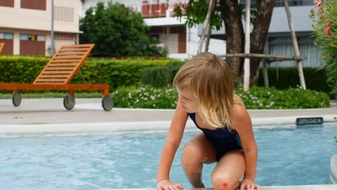 Child crawls into the pool. Stock Footage 123388901