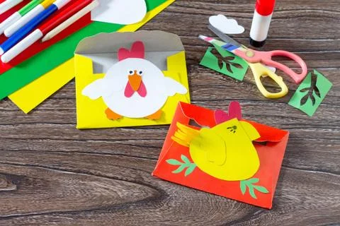 The child create Easter card envelope letter chicken. Handmade. Stock Photos
